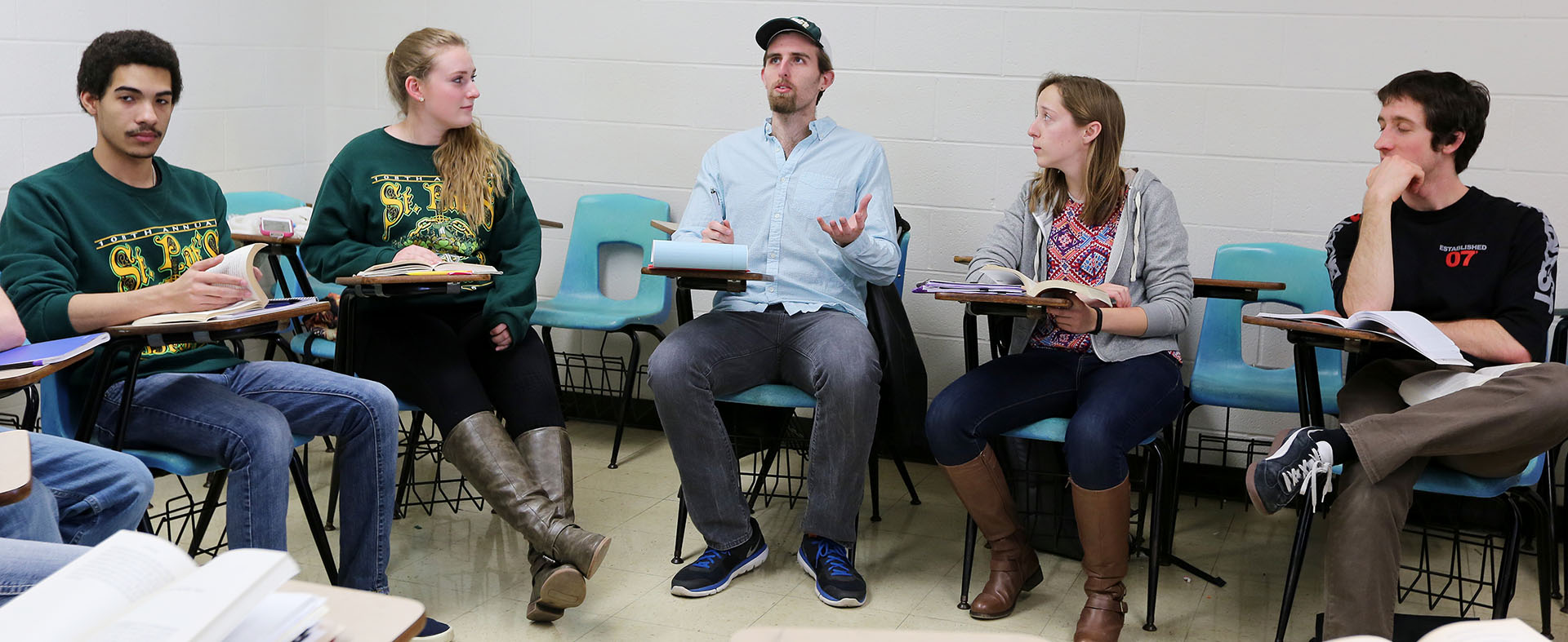 A group of students sitting in a circle in a classroom